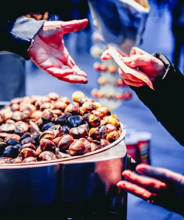 Person Paying Bill in Front of Nuts