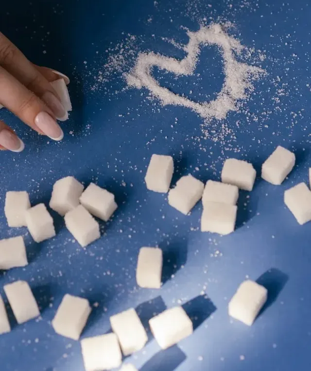 White Sugar Cubes on Blue Surface