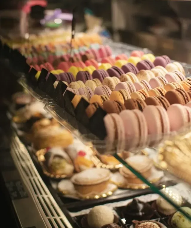 French macaroons inside a glass display cabinet