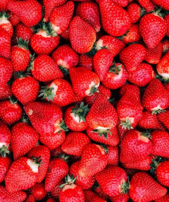 red strawberries on white ceramic plate