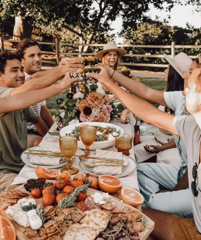 people sitting on chair eating food during daytime