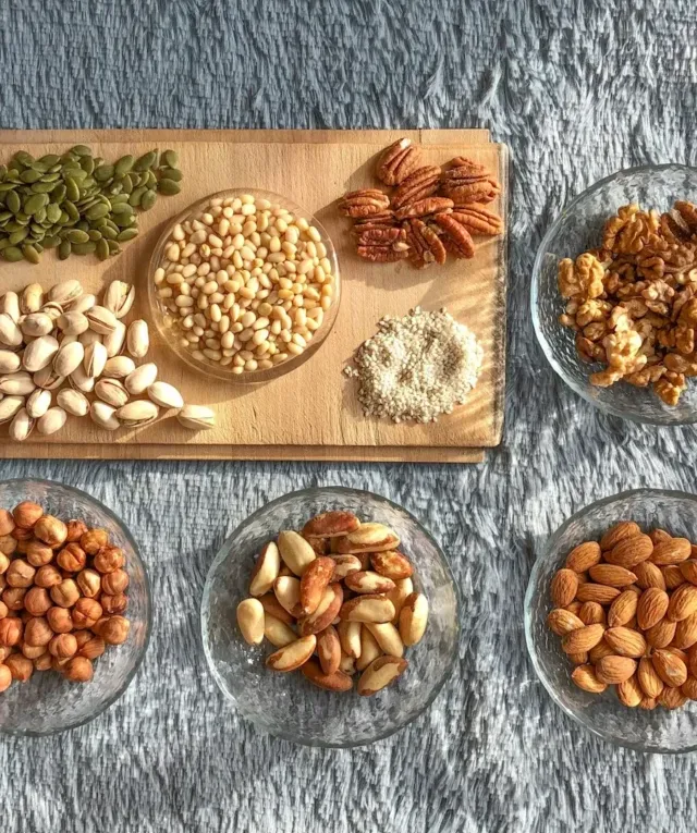 brown and white nuts on white ceramic bowls